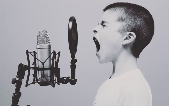 Boy Shouting At Microphone